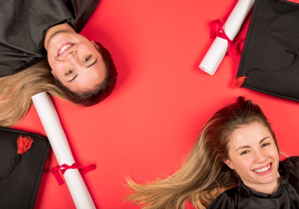 beautiful-graduates-with-red-background